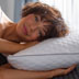 Woman laying head on pillow
